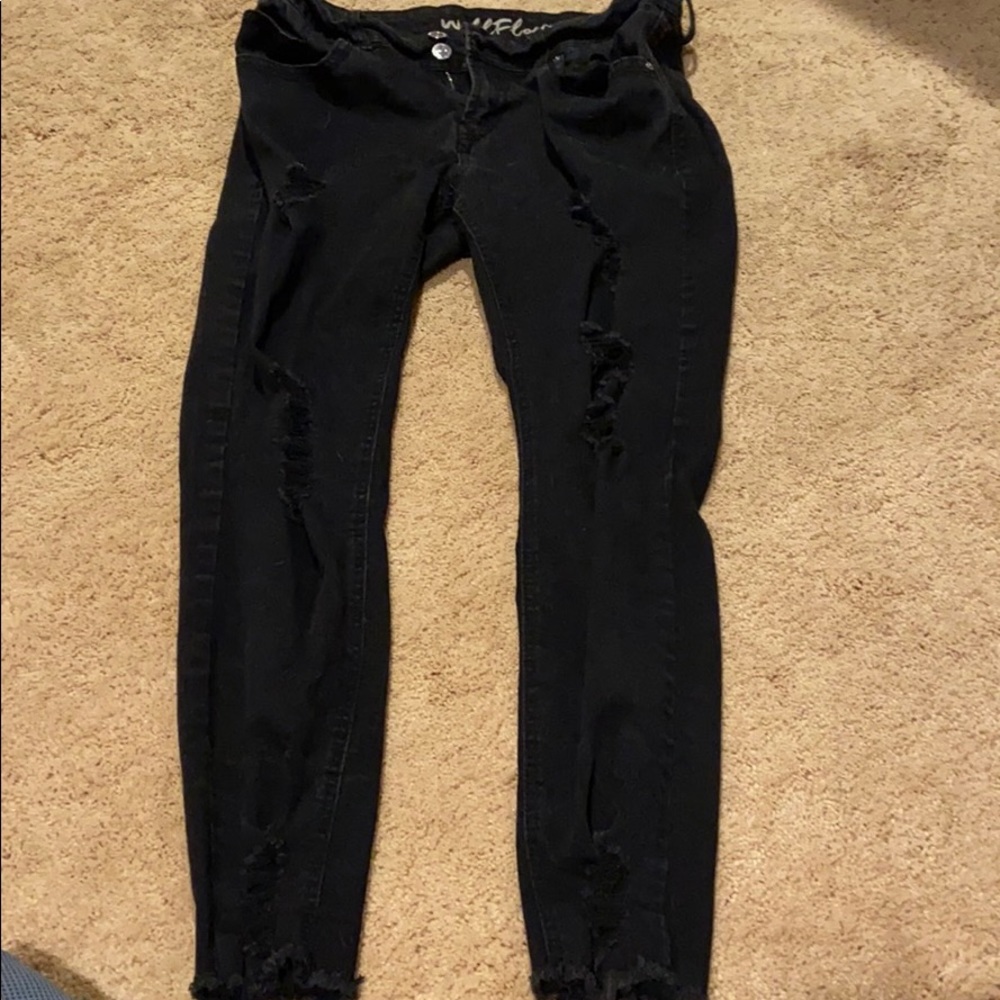 Black distressed jeans.
